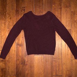 Burgundy sweater with detail on the back